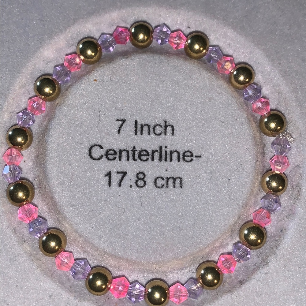 Pink and purple crystal stretch Bracelet with gold balls